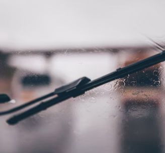 shallow focus photography of black vehicle wiper