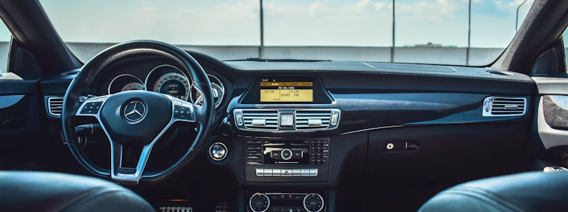 black Mercedes-Benz vehicle steering wheel